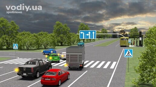 Дорожні знаки: 5.16 «Напрямки руху по смугах», 5.38.1 «Пішохідний перехід», 5.38.2 «Пішохідний перехід», рух червоного автомобіля через перехрестя прямо