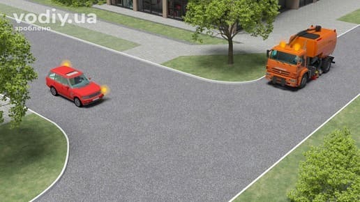 Проїзд нерегульованого перехрестя рівнозначних доріг автомобілем з увімкненим оранжевим проблисковим маячком