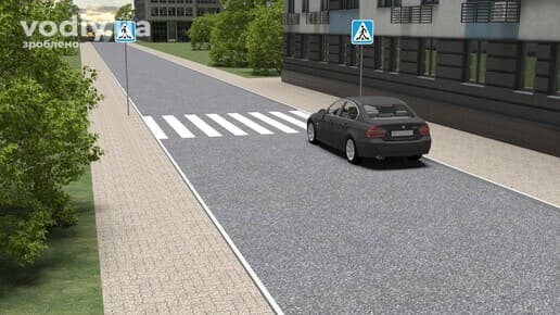 Чорний автомобіль стоїть біля пішохідного переходу, дорожні знаки: 5.38.1 «Пішохідний перехід», 5.38.2 «Пішохідний перехід», край проїзної частини.