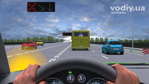 Випередження автобуса на дорозі з реверсивним рухом, червоний сигнал реверсивного світлофора, розмітка 1.9.