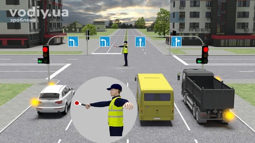 Регулювальник на перехресті, руки розведені в сторони, дорожні знаки 5.18, червоний сигнал світлофора, автобус, вантажівка та легковий автомобіль.