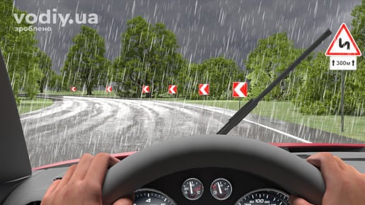 Рух автомобіля в дощ, дорожні знаки: 1.3.2 «Декілька поворотів», 7.2.1 «Зона дії», 1.4.1 «Напрямок повороту», вид з місця водія на мокру дорогу.