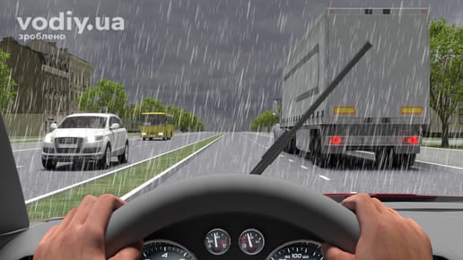 Випередження вантажного автомобіля під час дощу, робота склоочисників автомобіля