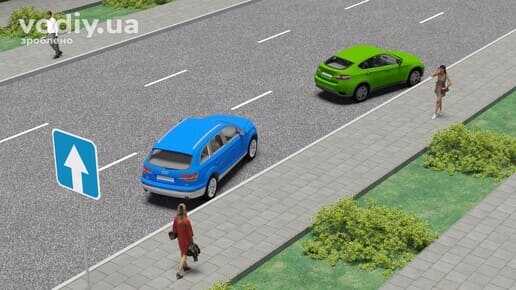 Дорожній знак 5.5 «Дорога з одностороннім рухом», синій та зелений автомобілі припарковані під кутом до краю проїзної частини біля тротуару.