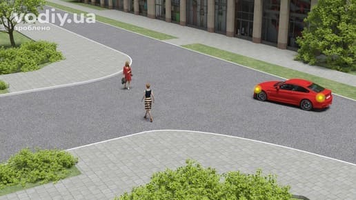 Червоний автомобіль з увімкненим правим покажчиком повороту та пішоходи, що переходять дорогу по лінії тротуару на перехресті.