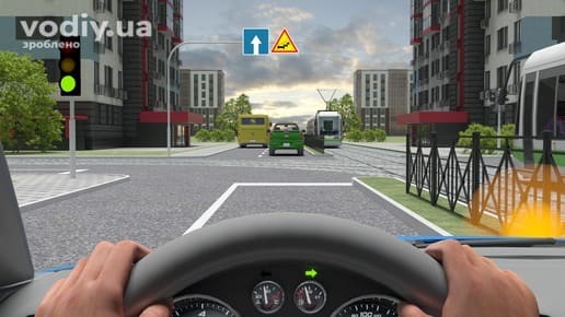 Синій автомобіль на перехресті, зелений сигнал світлофора, трамваї на коліях, дорожні знаки: 4.1 «Рух прямо», 1.10 «Нерівна дорога».