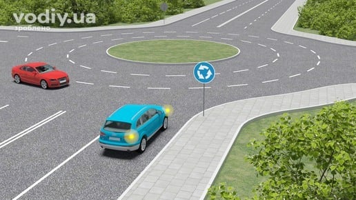 Синій та червоний автомобілі на перехресті з круговим рухом, дорожній знак 4.10 «Круговий рух», черговість проїзду транспортних засобів.